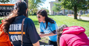 ALIVE volunteer helping at event