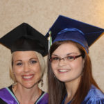2014 graduate with faculty member