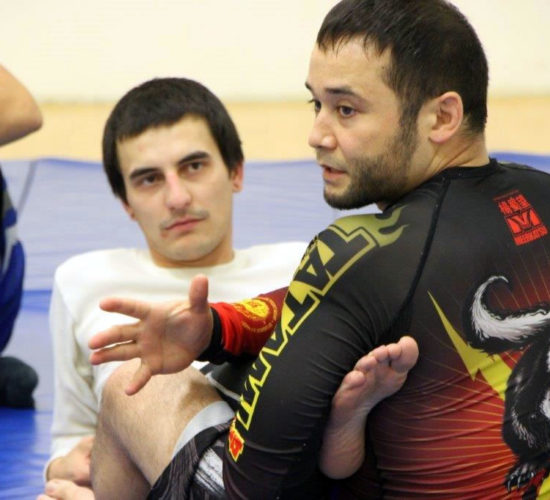 Jiu-Jitsu club members rolling on mats