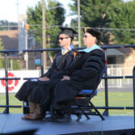 key note speaker and President Lees sitting on stage