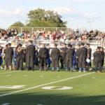 faculty and administrators waiting to walk in