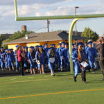graduates on the field