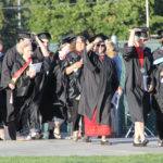 faculty waiting their turn to walk in