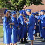 group of graduates waiting to line up for ceremony