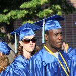 two students waiting to line up for ceremony