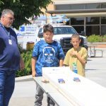 students and teacher at car solar race station