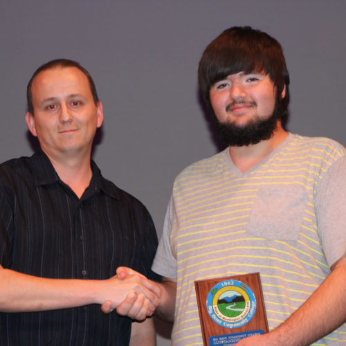 Teacher giving student award