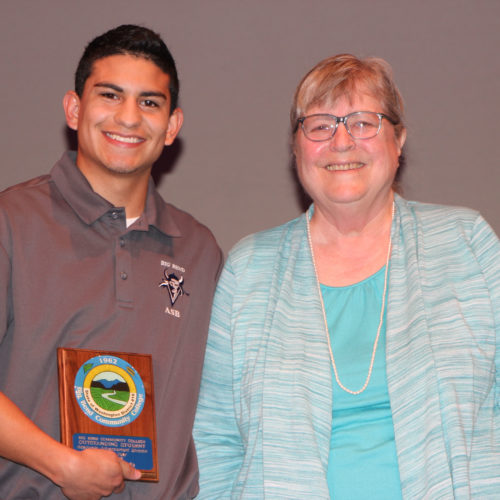 Teacher giving student award