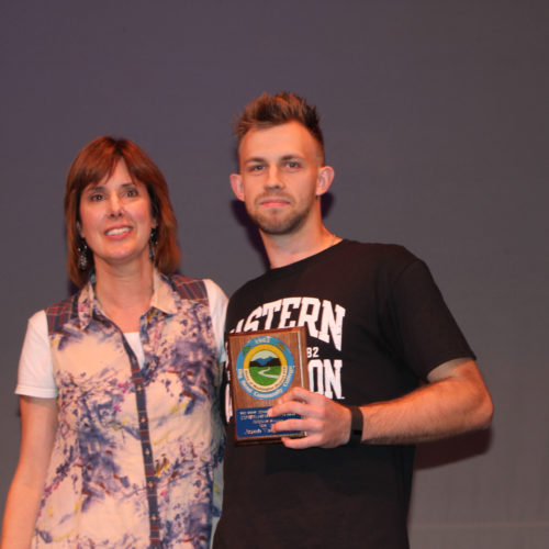 Teacher giving student award