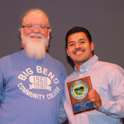 Teacher giving student award