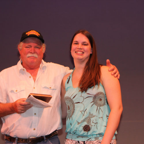 Teacher giving student award