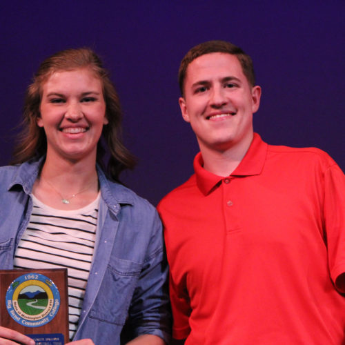 Teacher giving student award