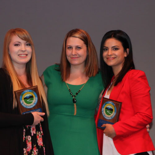 Teacher giving students award