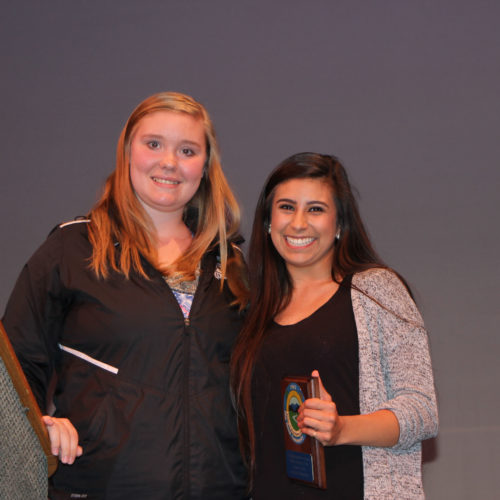 Teacher giving student award