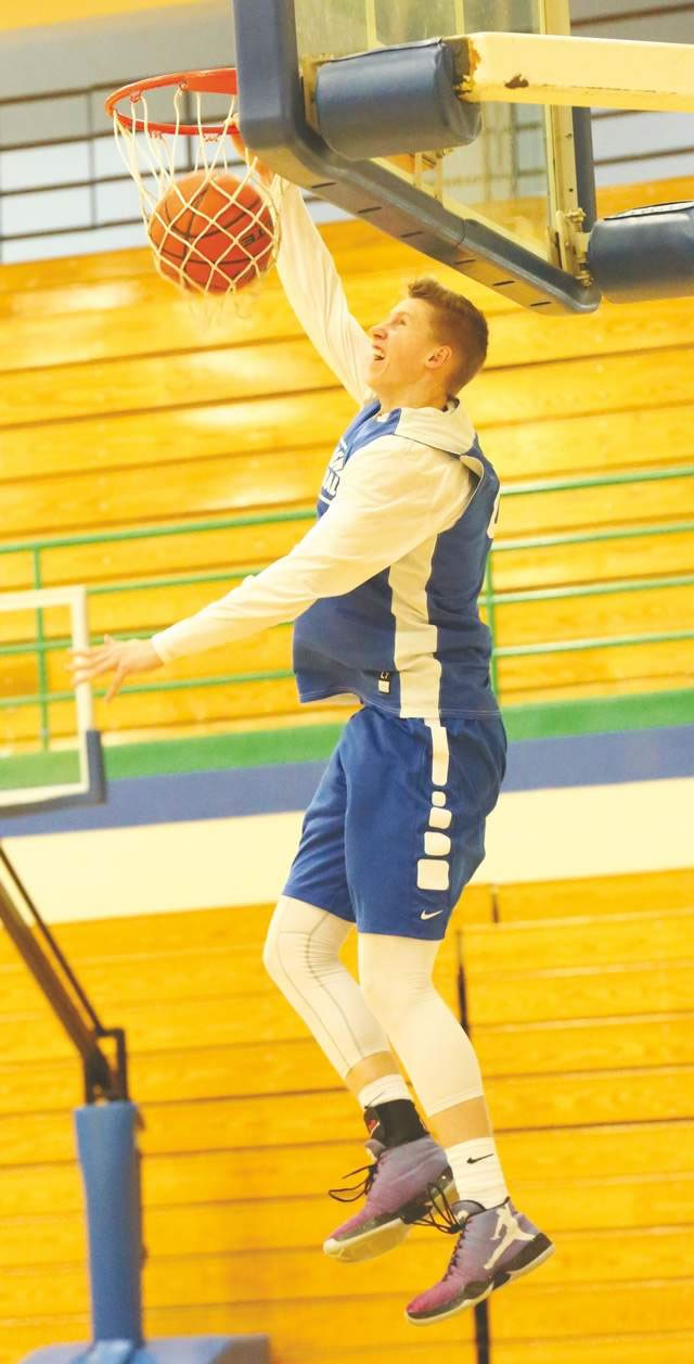 Josh Erickson dunking basketball