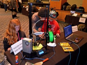 Participants checking out the 3D printer