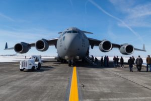 students walking up to C-17