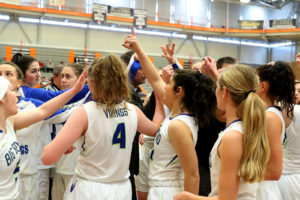 lady vikes huddled in a circle