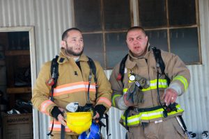 Firefighter and guest ready for training