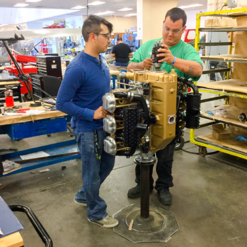 Students working on airplane motor