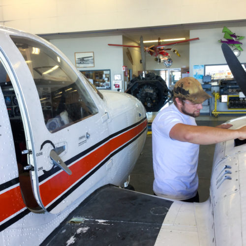 Student working on airplane