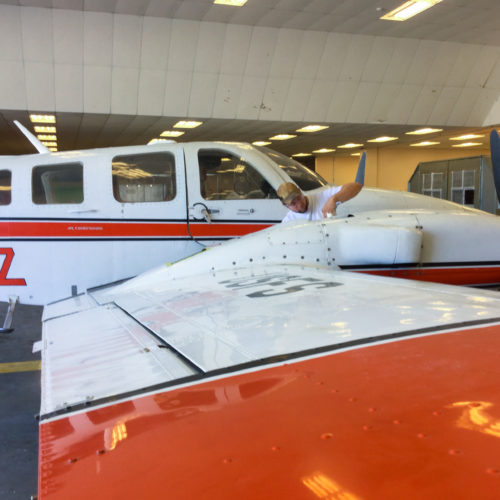 Student working on airplane