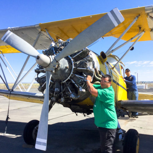 Student working on airplane