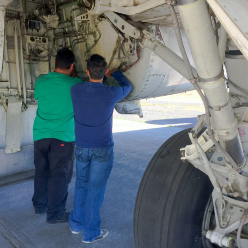 Students working on airplane