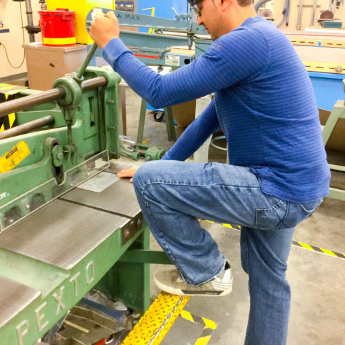 Student working with a press