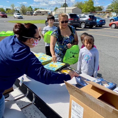 Parent and child at BBCC book donation