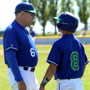 coach with a baseball player