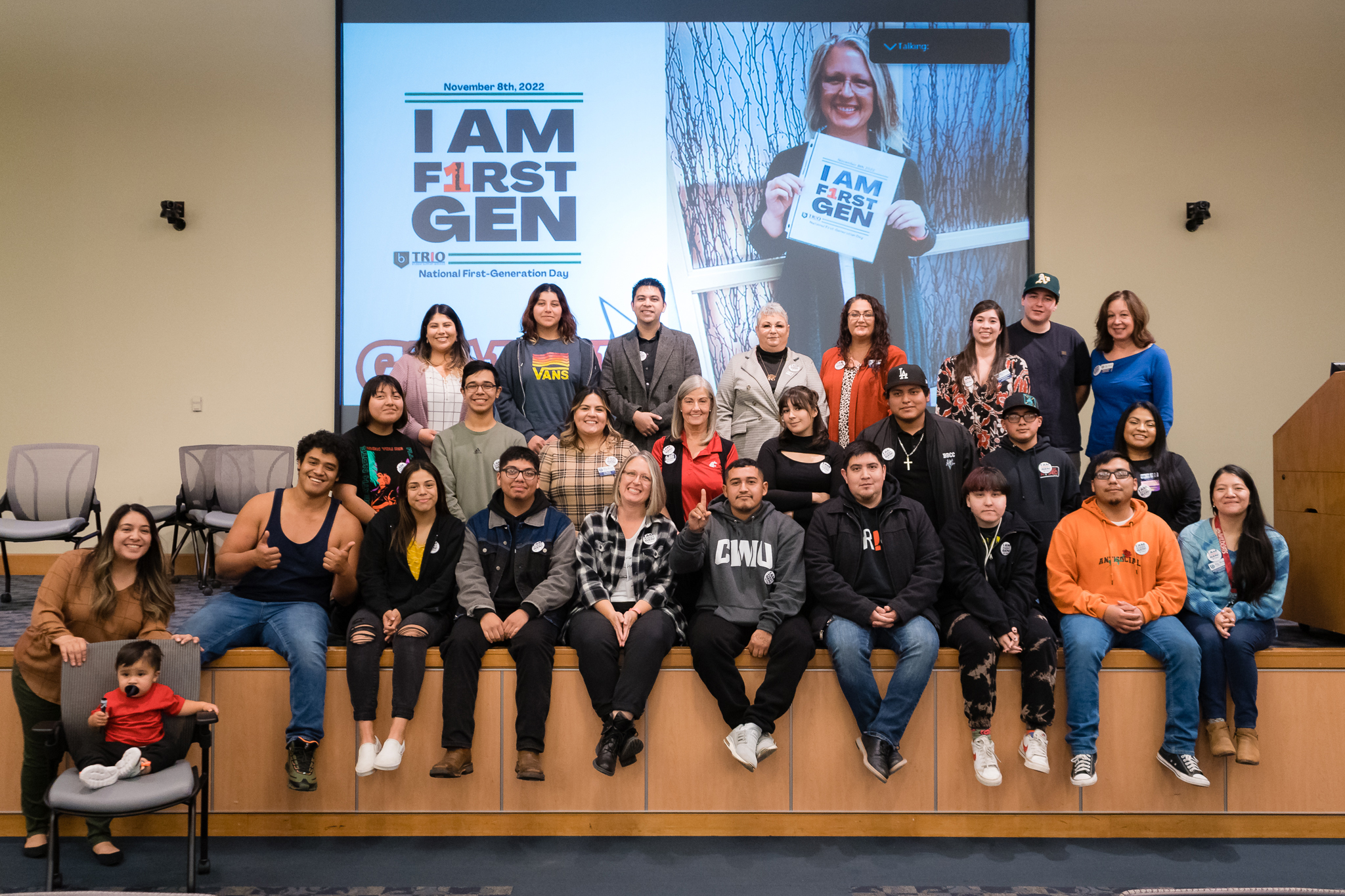 first generation students and staff on stage