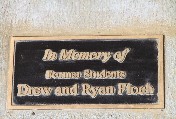 Bronze plaque in memory of former students Drew and Ryan Flochs