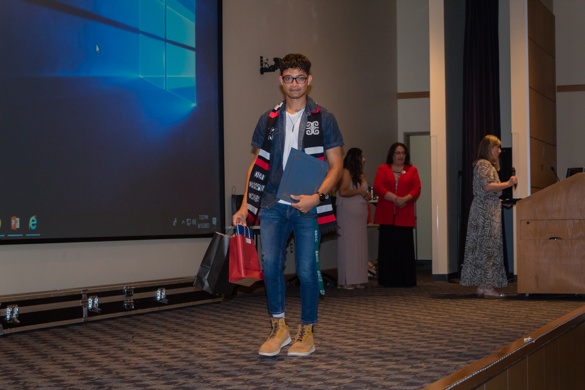 male student smiling after getting award