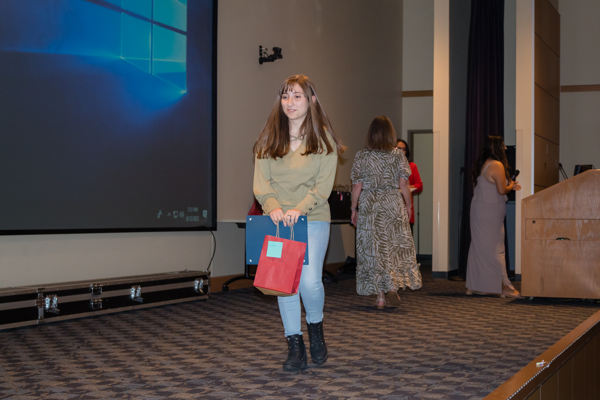 female student smiling after getting award