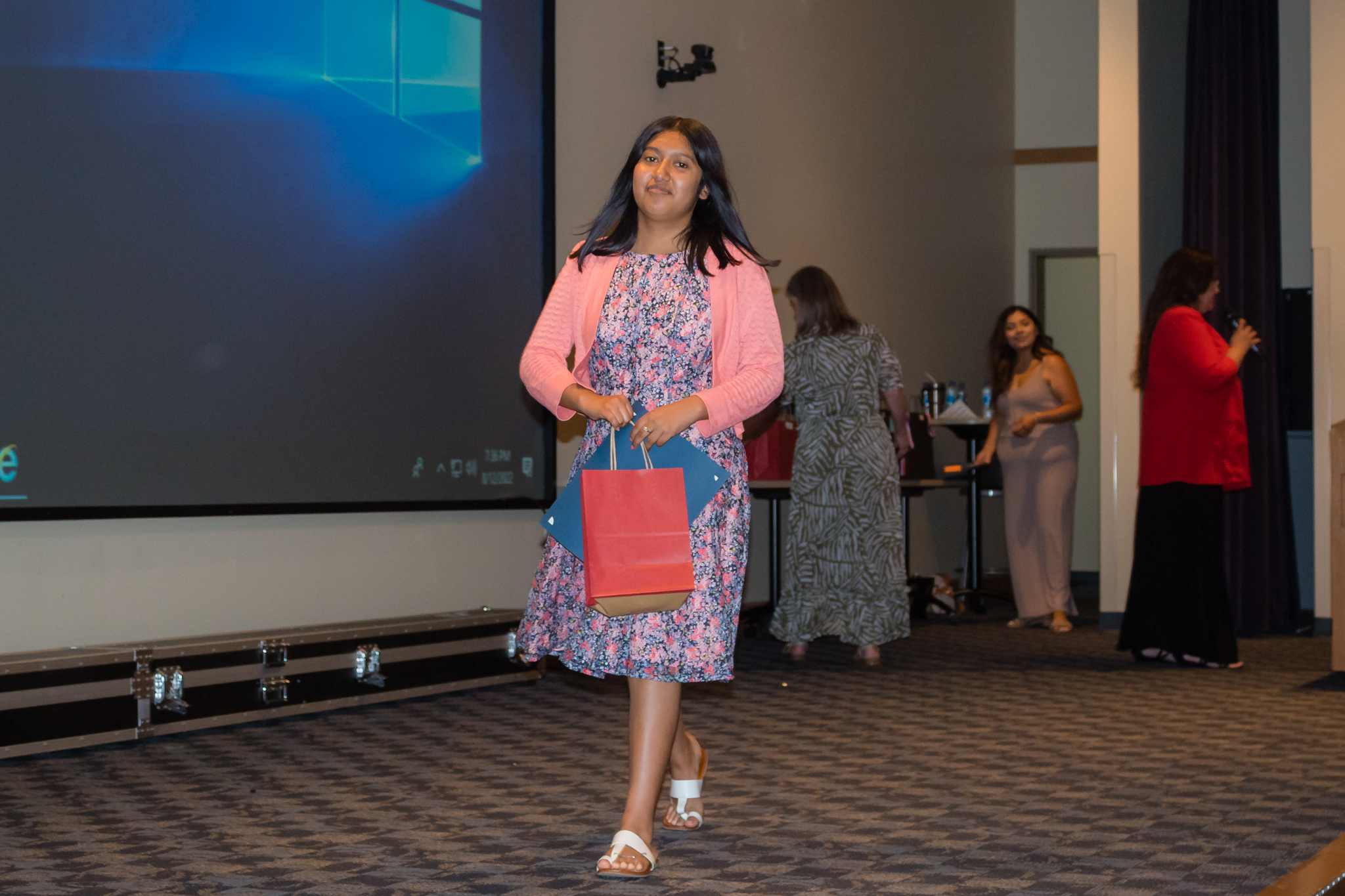 female student smiling after getting award