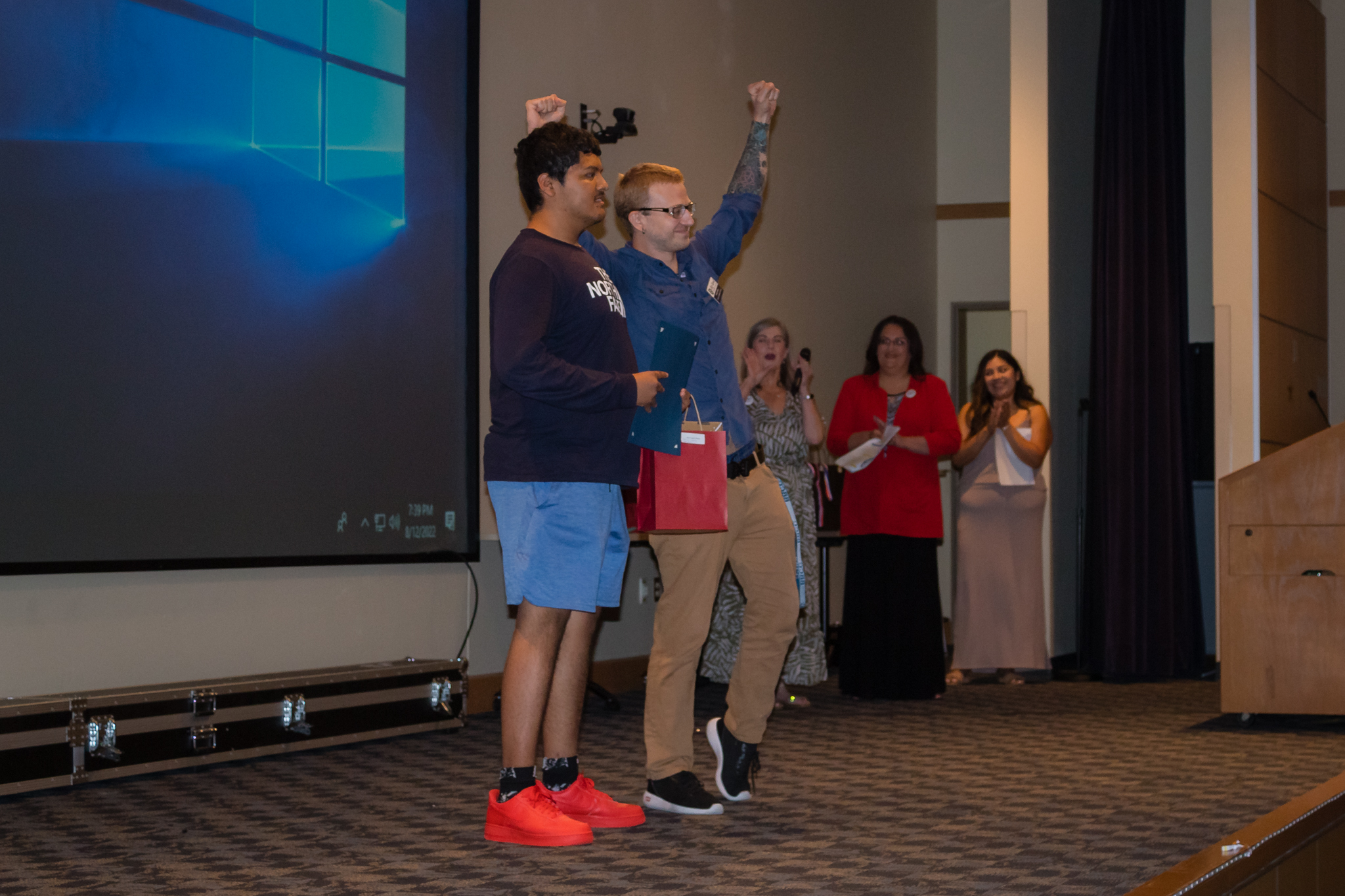 male student smiling after getting award