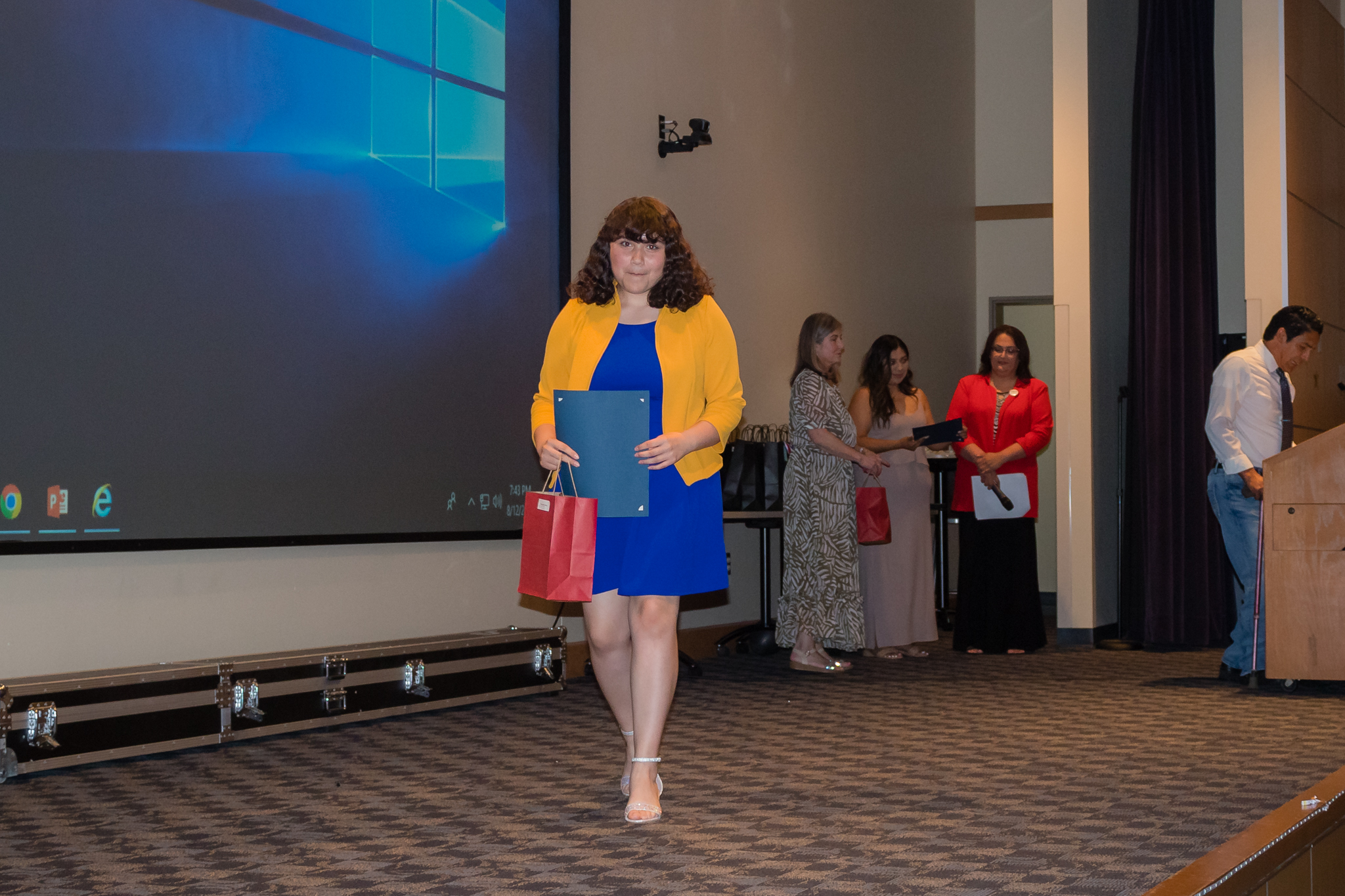 female student smiling after getting award