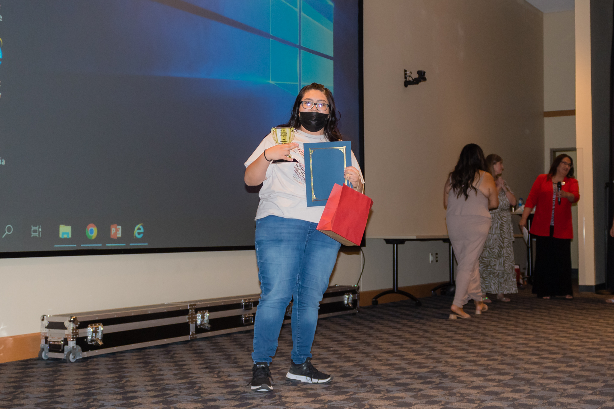 female student smiling after getting award