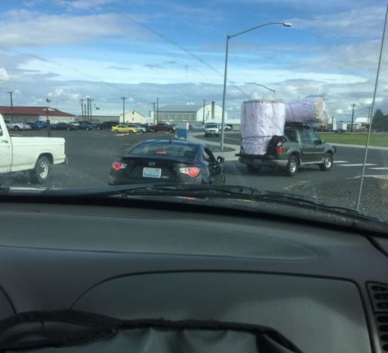 Jiu-Jitsu club members transporting mats by pickup truck