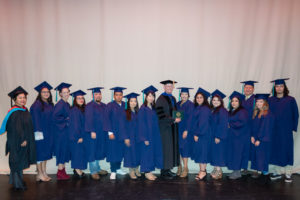 students in caps and gowns