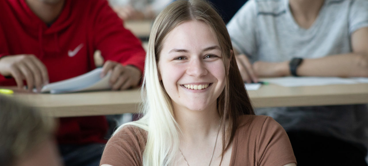 A student smiles during a filibuster in the mock Senate.