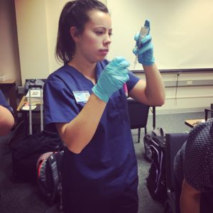 nursing student using injection practice