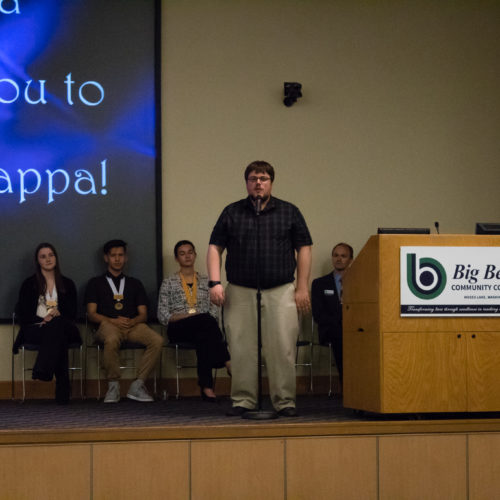 Students being inducted to Phi Theta Kappa