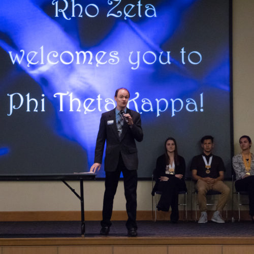 Students being inducted to Phi Theta Kappa