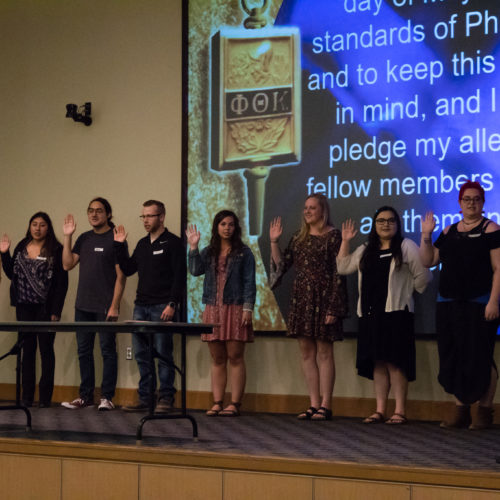 Students being inducted to Phi Theta Kappa