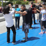 audience participates in self defense practices