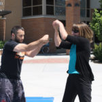 audience participates in self defense practices