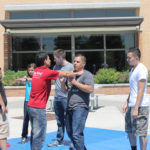 audience participates in self defense practices