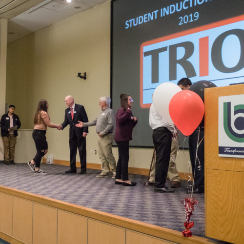 Students being congratulated TRIO member induction